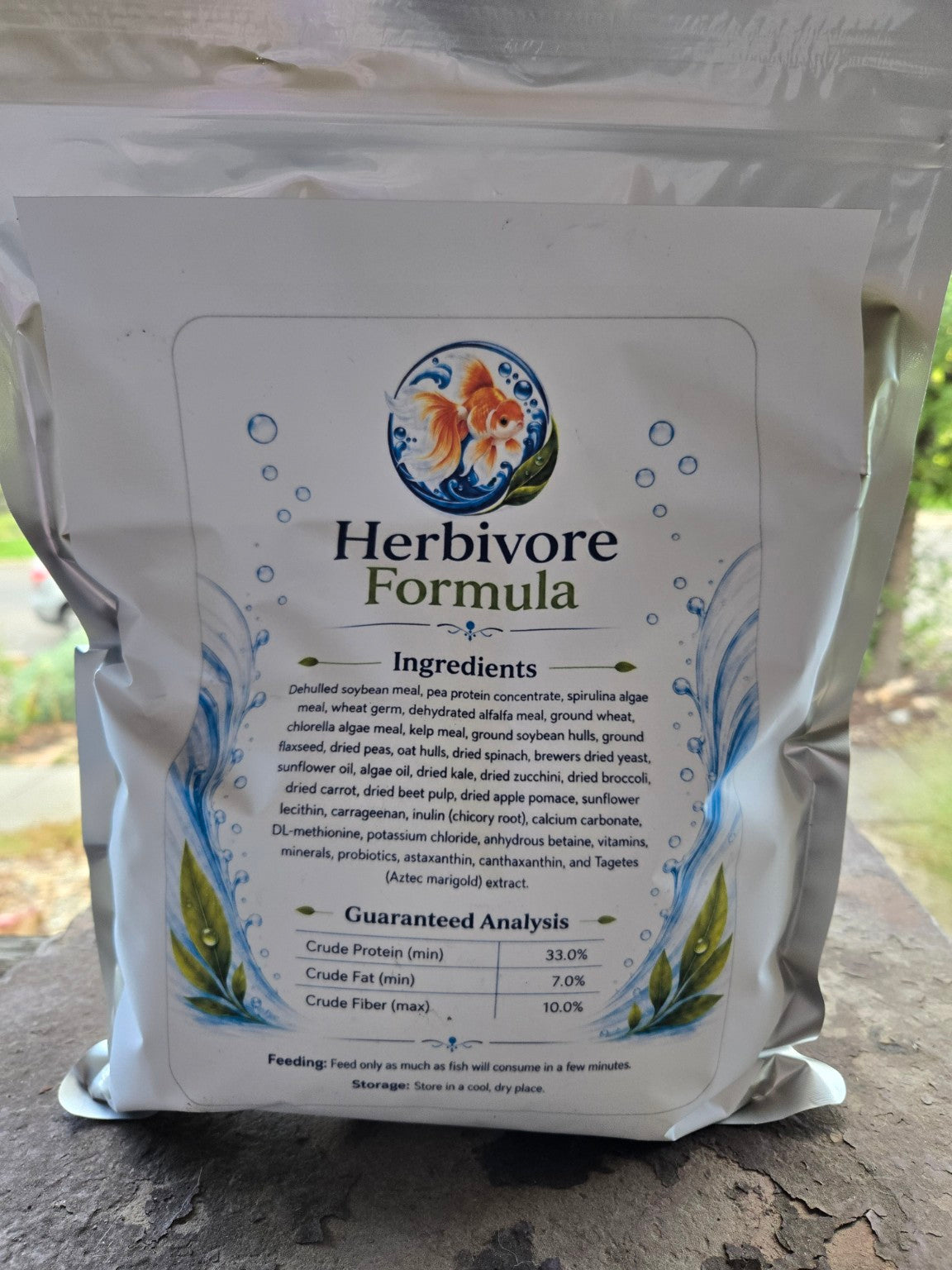 Actual Herbivore Formula 2.5 mm pouch photographed outdoors, back label with ingredients and guaranteed analysis.