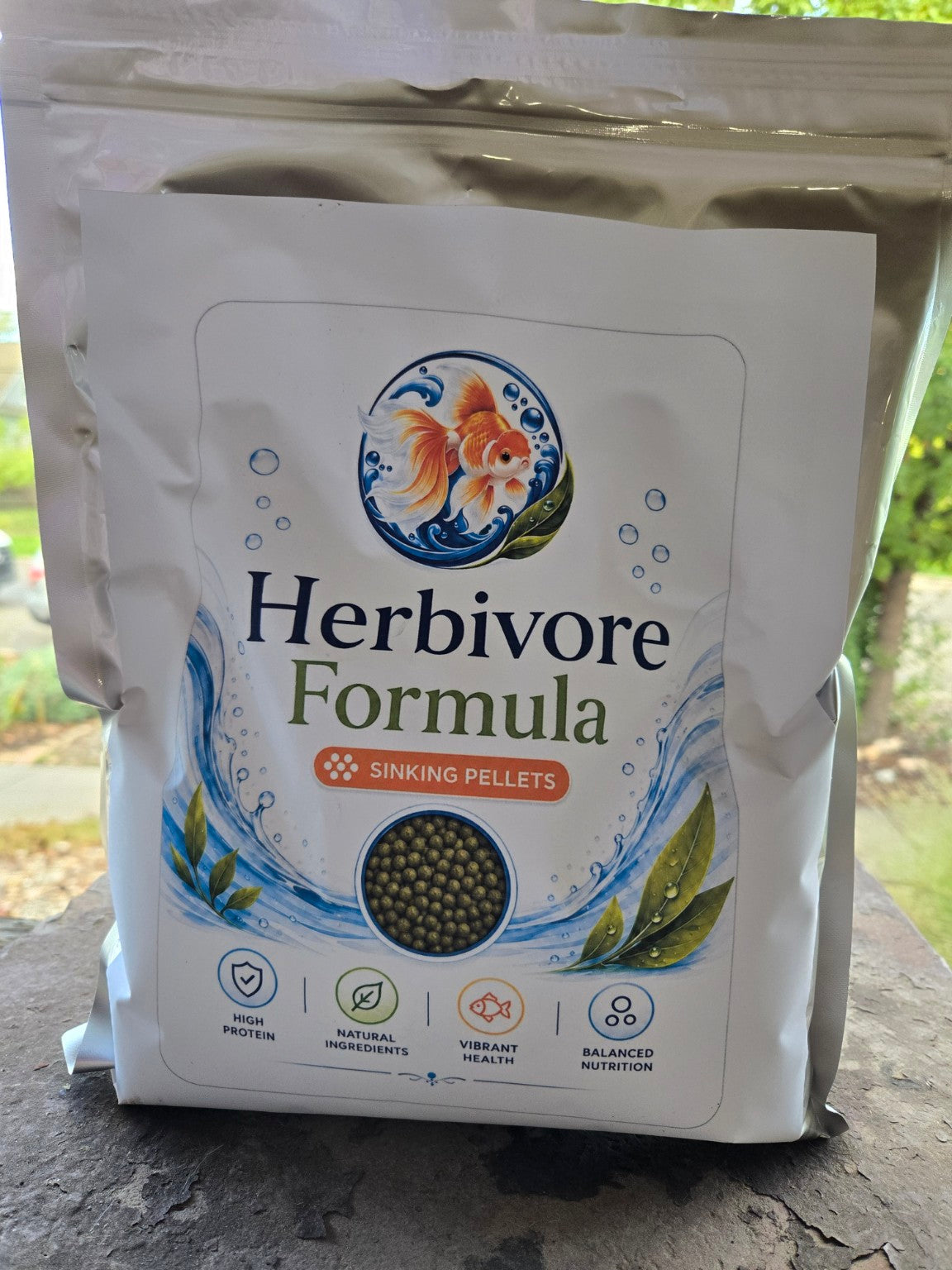 Actual FinNaturals Herbivore Formula 2.5 mm silver pouch photographed outdoors, front label.