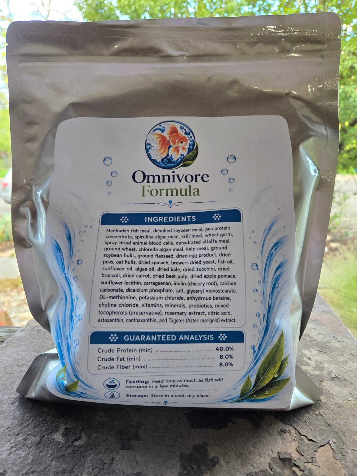 Actual Omnivore Formula 2.5 mm pouch photographed outdoors, back label with ingredients and guaranteed analysis.