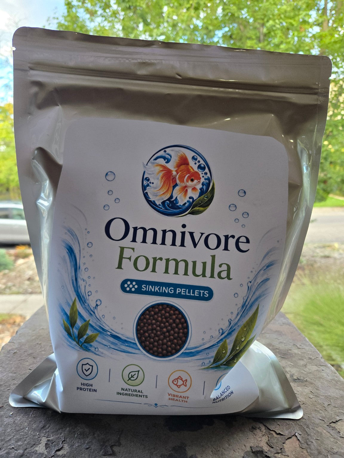 Actual FinNaturals Omnivore Formula 2.5 mm silver pouch photographed outdoors, front label.